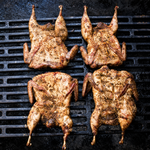 Four Texas farm-raised quail cooked on a grill